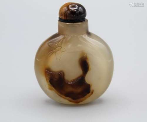 Snuff Bottle. Chalcedony of flattened round form with a smal...