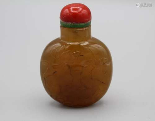 Snuff Bottle. Chalcedony of flattened rounded shape resting ...