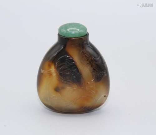 Snuff Bottle. Chalcedony of flattened pear shape resting on ...