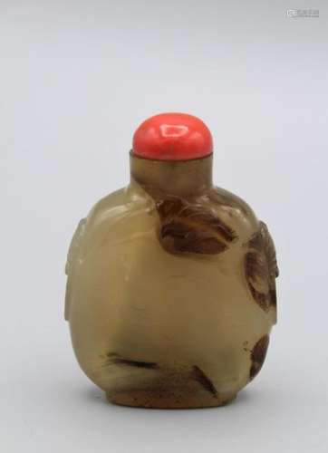 Snuff Bottle. Chalcedony of flattened ovoid shape on a broad...