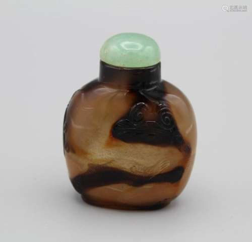 Snuff Bottle. Chalcedony of compressed ovoid form on a raise...