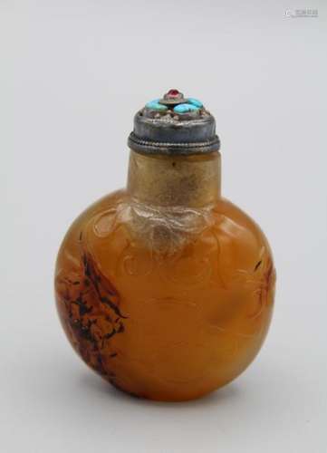 Snuff Bottle. Chalcedony of compressed ovoid form resting on...