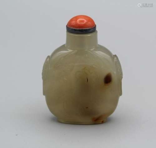 Snuff Bottle. Chalcedony of flattened ovoid form, on a broad...