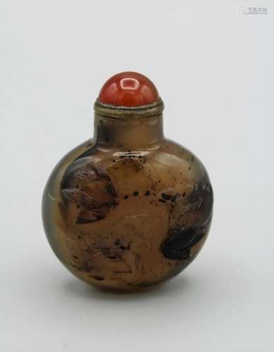 Snuff bottle. Chalcedony of compressed rounded form resting ...