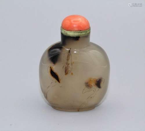 Snuff bottle. Chalcedony of rounded rectangular form on a br...