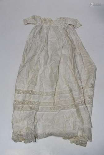 A cotton and lace childs gown, having decorative trimmed col...