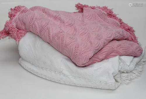 A woven pink cotton bedspread with tassle fringe, approximat...