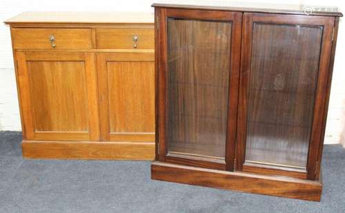 An Edwardian light oak cupboard, the rectangular top over tw...