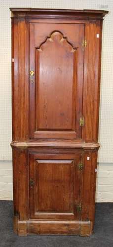 An early 19th century pitched pine floorstanding corner cupb...