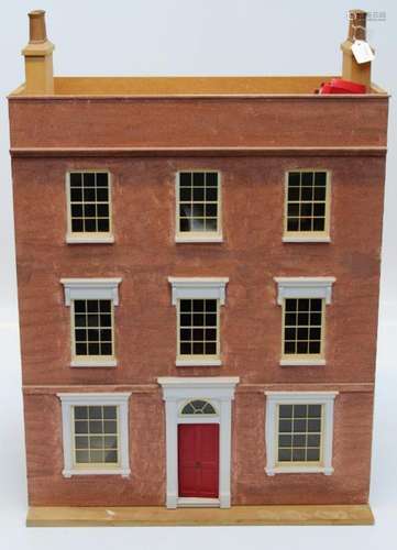 A large Dolls house in the form of a mid 18th century townho...