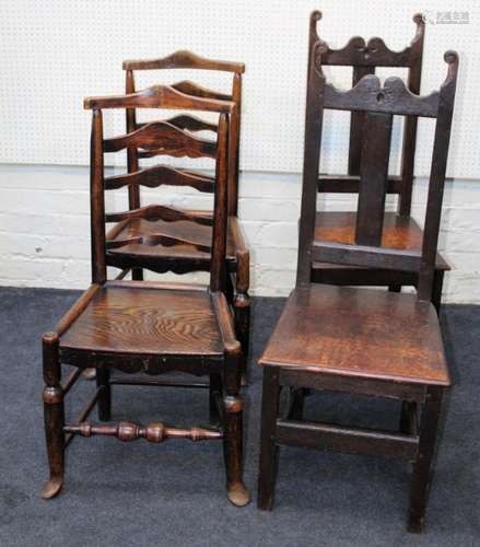 A pair of early 19th century beech and elm ladderback dining...