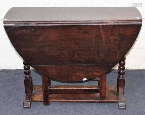 A late 18th century oak gateleg table of pegged construction...