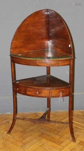 An early 19th century mahogany corner washstand, the raised ...