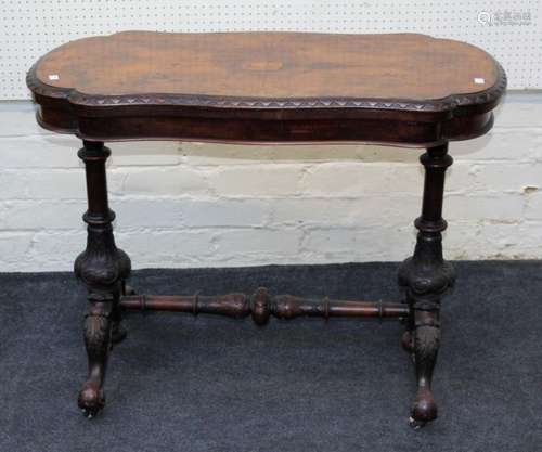 A Victorian walnut card table, the shaped quarter veneered s...