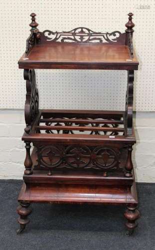 A Victorian walnut Canterbury whatnot with three quarter gal...