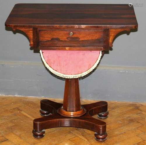 An early 19th century simulated rosewood work table, the rec...