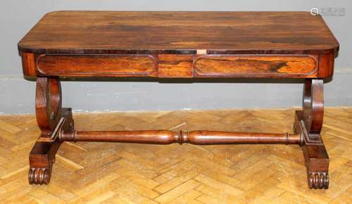 A late Regency rosewood library table, the rectangular top o...