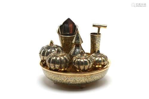 A fine miniature gilded silver niello betel nut set comprisi...