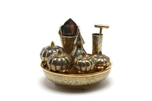 A fine miniature gilded silver niello betel nut set comprisi...