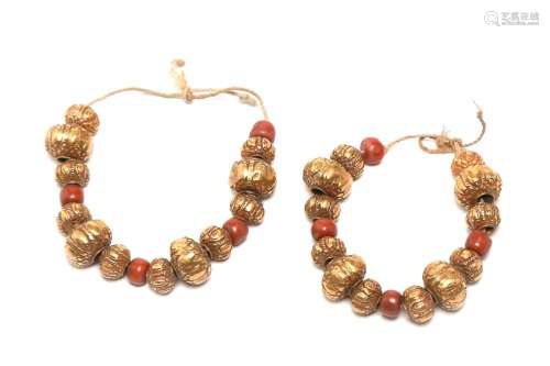 Two sheathed gold beads necklace