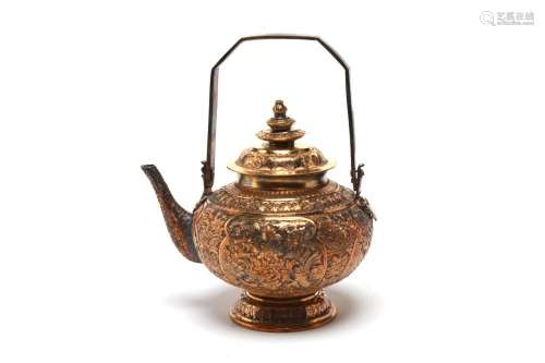 A carved and repousse' gilt silver teapot with an uprigh...