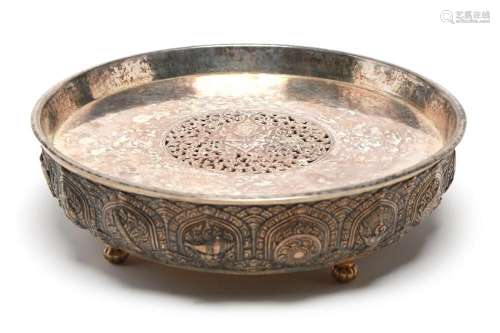 A carved and repousse' silver tray decorated in relief w...
