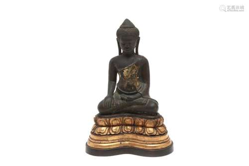 A bronze seated Buddha in Subduing Mara posture on gilt wood...