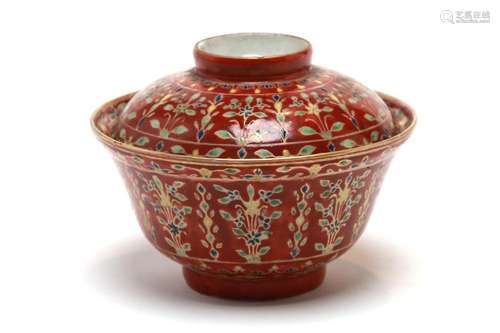 A Benjarong covered bowl painted with a floral design on a r...