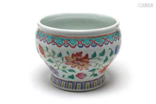 A polychrome porcelain spittoon painted with peony flowers a...