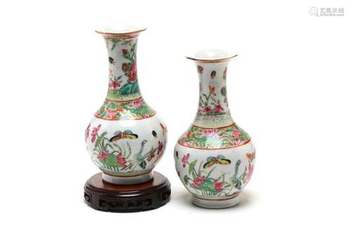 A pair of Cantonese bottle vases, each painted with butterfl...