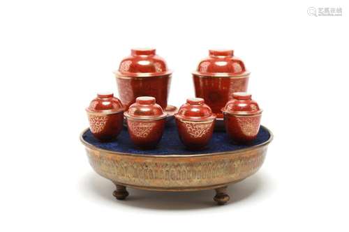 A polychrome porcelain Jibo tea set with brass tray, each pa...