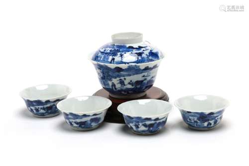 A blue and white porcelain tea set comprising four teacups a...