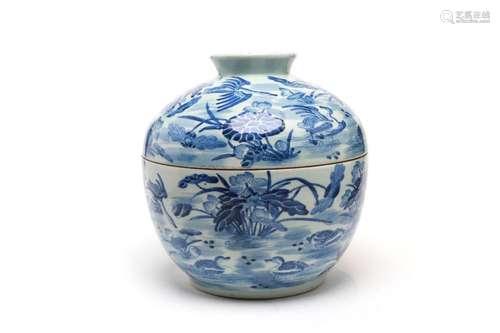 A large blue and white porcelain covered bowl painted with m...