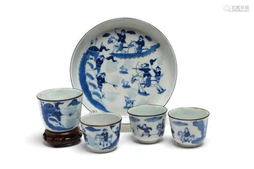 A blue and white porcelain tea set comprising four teacups a...