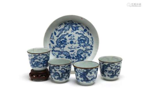 A blue and white porcelain tea set comprising of four teacup...