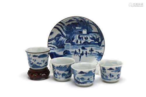 A blue and white porcelain tea set comprising of four teacup...