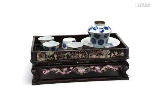 A blue and white porcelain tea set painted with floral desig...