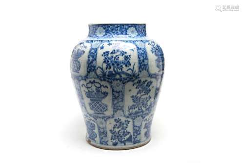A large blue and white porcelain jar painted with shaped pan...