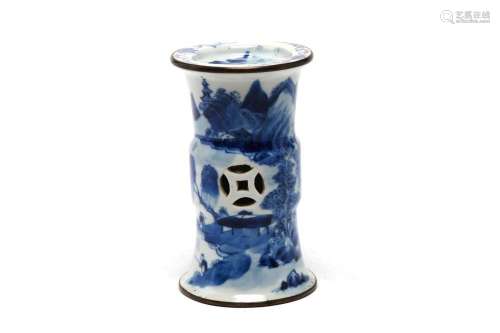 A small blue and white porcelain stand painted with a contin...
