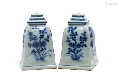 A pair of blue and white porcelain bell-shaped candlestick h...