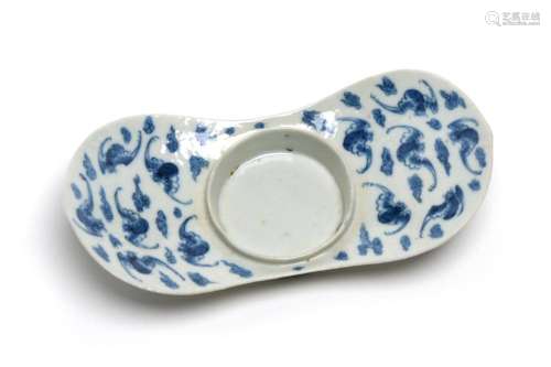 A blue and white porcelain tray painted with bats on a backg...