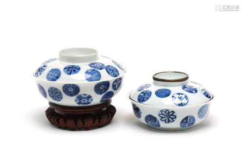 Two blue and white porcelain covered bowls, each painted wit...