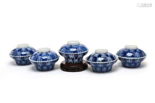 Five blue and white porcelain covered bowls, each painted wi...
