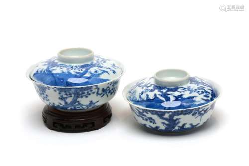 A pair of blue and white porcelain covered bowls painted wit...
