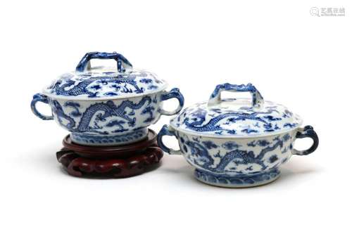 A pair of blue and white porcelain covered soup containers p...