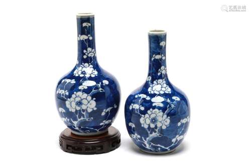 A pair of blue and white porcelain bottle vases, each painte...