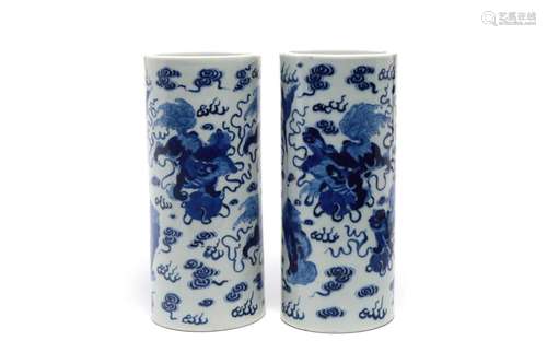 A pair of blue and white porcelain cylindrical vases, each p...