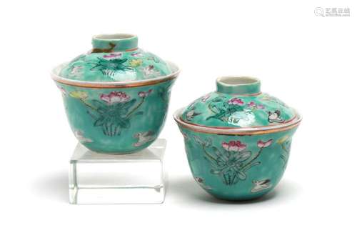 A pair of polychrome porcelain tea cup painted with mandarin...