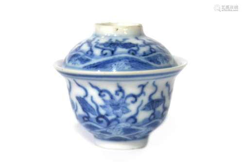 A miniature of blue and white porcelain covered teacup paint...