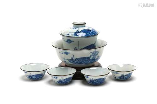 A blue and white porcelain tea set painted with landscape de...